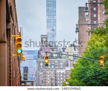 Bottom view of Elevated train track nyc. Buildings in the background in a foggy day. NYC, USA.