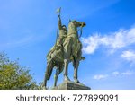 Bottom view of equestrian statue of Vimara Peres in Historic Centre of Porto, Portugal in a sunny day. The statue is located near Cathedral of Oporto or Se do Porto.