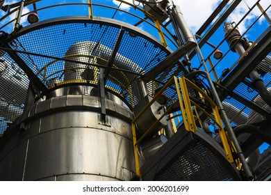 Bottom View Of The Gas Separator Gas Pipeline, Gas Industry, Gas Transmission System Against The Background Of Blue Sky And Clouds