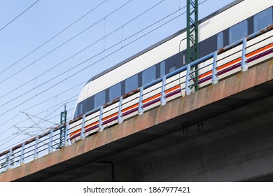 bottom view of high speed train passing over bridge