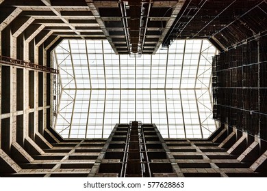 Bottom view from internal yard on an unfinished building to glass roof