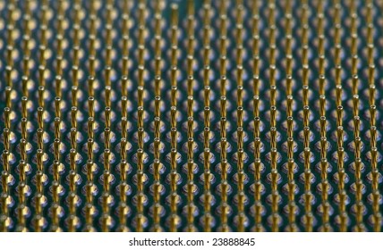 Bottom view of a modern CPU. Macro, creating a very regular, abstract pattern.