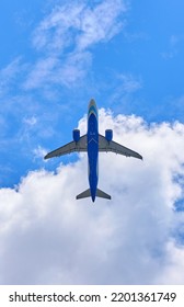 bottom view of a passing passenger plane - Shutterstock ID 2201361749