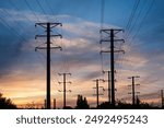 Bottom view of power line turn against sunset. Background. Landscape.