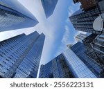 Bottom view of skyscrapers in the Hudson Yards, Manhattan, New York City. Blue sky within tall towers