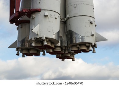 Bottom view of space rocket nozzles on sky background