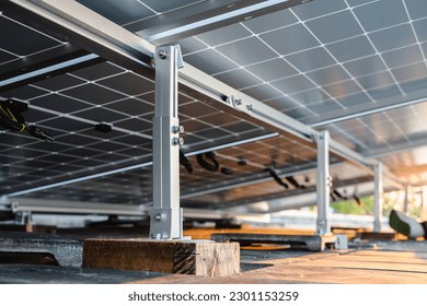 Bottom view of the structure of the solar panel mounting rail on the roof of the building.