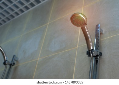 Bottom View Of Turned Off Showers In A Public Shower With Tiles And Lighting. Concept Of Common Showers In The Fitness Room Or Pool