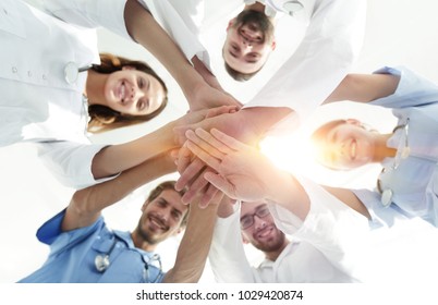 bottom view.a team of doctors at the medical center clasped thei - Powered by Shutterstock