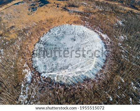 Bottomless circle Lake in spring forest of Solnechnogorsk District, Moscow region. Russia. Aerial view
