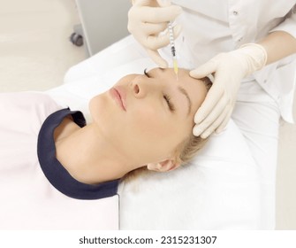 Botulinum toxin injection for facial wrinkles  ,in the therapy of mimic facial lines, non-invasive treatment for mimic facial wrinkles and neck and decollete lines.Cosmetic botulinum toxin injection - Shutterstock ID 2315231307