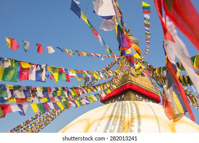 Boudhanath stupa - symbol of Nepal, with colorful prayer flags.