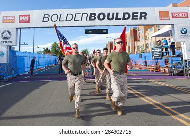 BOULDER, CO - May 25th, 2015: Military Runners Cross The Start Line Of The Bolder Boulder 10K Race In Boulder, Co. The Race Is The Largest Timed Race In The Country With Over 54,000 Participants.