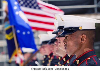 BOULDER, CO - May 25th, 2015 - US Military Service Men Stand In Formation For The National Anthem During The Bolder Boulder 10K Memorial Day Service At Colorado University's Folsom Field