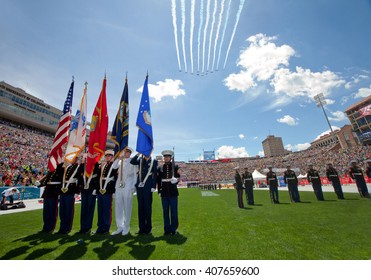 BOULDER, CO - May 25th, 2015 - US Military service men stand in formation for the national anthem during the Bolder Boulder 10K Memorial Day service at Colorado University's Folsom Field