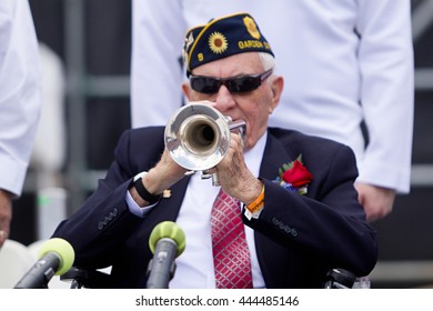 BOULDER, CO - May 25th, 2015 - US Military Veteran Plays TAPS On The Trumpet During The Bolder Boulder 10K Memorial Day Service At Colorado University's Folsom Field.