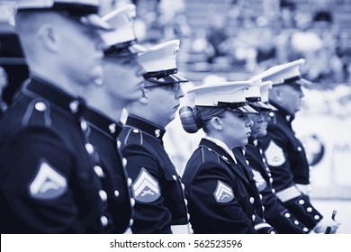 BOULDER, CO - May 25th, 2015 - US Military Service Men And Women Stand In Formation For The National Anthem During The Bolder Boulder 10K Memorial Day Service At Colorado University's Folsom Field