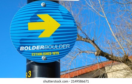 Boulder, CO USA - April 22, 2022: Round Blue And Yellow Street Sign For The Bolder Boulder 10K Foot Race That Is Held On Memorial Day. Runs Through The University Of Colorado Folsom Field Stadium