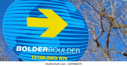 Boulder, CO USA - April 22, 2022: Round Blue And Yellow Street Sign For The Bolder Boulder 10K Foot Race That Is Held On Memorial Day. Runs Through The University Of Colorado Folsom Field Stadium