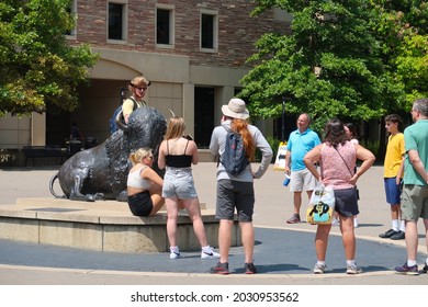 Boulder, CO USA - August 18, 2021: Campus Tour For Prospective Students And Families. Student Tour Guide With Buffalo Horns Speaks To Visitors By The Buffalo Statue                              