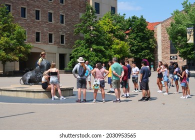 Boulder, CO USA - August 18, 2021: Campus Tour For Prospective Students And Families. Student Tour Guide With Buffalo Horns Speaks To Visitors By The Buffalo Statue                              