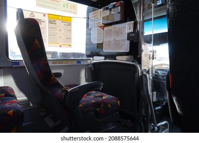 Boulder, CO USA - December 3, 2021: Interior Of A Public Bus. Front Seat With Windows And Poster Signs