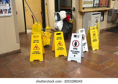 Boulder, CO USA - September 24, 2021: Many Signs Mark A Public Bathroom Being Cleaned. Do Not Enter. Restroom Closed. Caution Wet Floor.