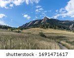 Boulder Colorado Flatirons in Chautauqua Park with Blue Sky and Clouds Landscape