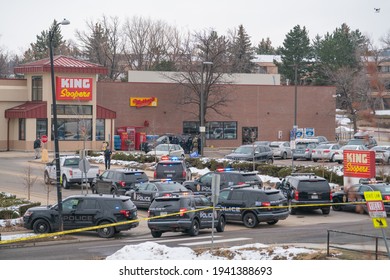 Boulder, Colorado USA - March 22, 2021: Police and SWAT officer in front of King Soopers - the scene of a mass shooting