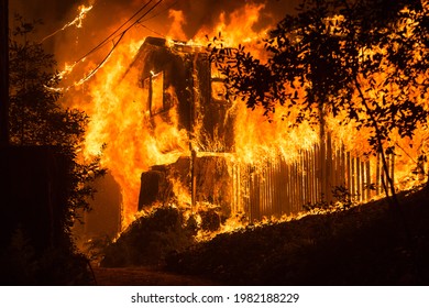 BOULDER CREEK, CALIFORNIA - AUGUST 20, 2020: A Home Is Fully Engulfed In Flames On Acorn Drive After Being Set Alight By The CZU Lightning Complex Wildfire.