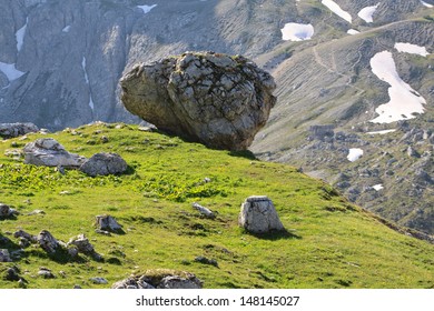 boulder hovering over the valley