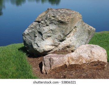 Boulder with lake background