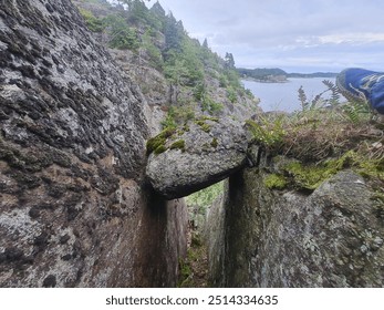 a boulder suspended in a crack