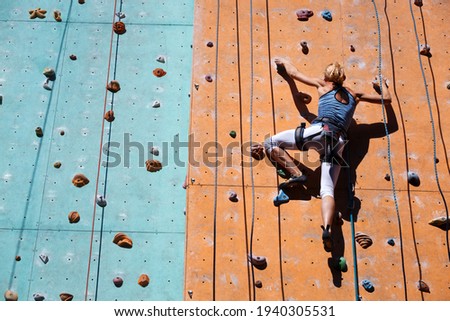 Similar – Image, Stock Photo Girl climbs climbing wall