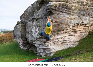 Bouldering outdoors in Northumberland, UK - Shutterstock ID 2079035095