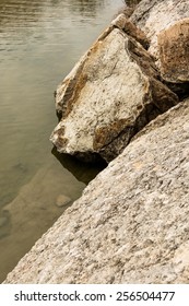 Boulders On The Shore Of The Blue Hole At Dinosaur Valley State Park Texas