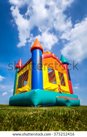 Bounce house inflatable jump castle in yard.