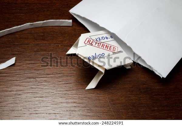 Bounced check folded into origami frog