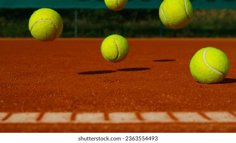 Bouncing tennis balls on clay court, freeze motion - Powered by Shutterstock