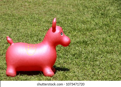 Bouncy Horse Toy In A Garden