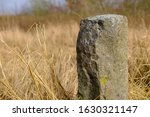 A boundary stone marks the size of the plot