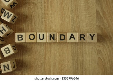 Boundary Word From Wooden Blocks On Desk