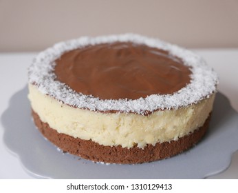 Bounty Cake with chocolate, desiccated coconut and sponge cake on the gray epergne - Shutterstock ID 1310129413