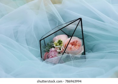 Bouqet Of Flowers In Crystal On The Blue Background