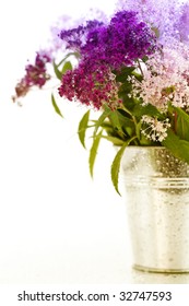 Bouqet Of Flowers In A Pot Over White