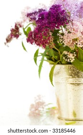 Bouqet Of Flowers In A Pot Over White