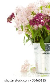 Bouqet Of Flowers In A Pot Over White