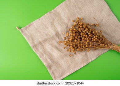 Bouquet of beautiful natural dry flax linen boxes closeup on a linen organic material, linen bag. image with copy space - Powered by Shutterstock