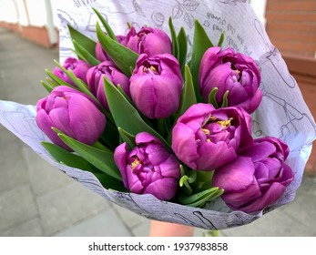 Bouquet With Beautiful Pastel Purple Garden Spring Tulips In A Paper Bag Outdoors High Angle View