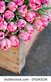 Bouquet of beautiful pink tulips in wooden box - Shutterstock ID 191043134